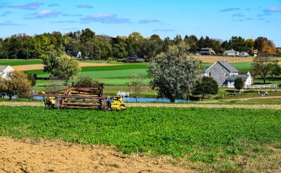 Amish Farm Equipment Sitting in the Field on an Amish Farm on a Sunny Summer Day